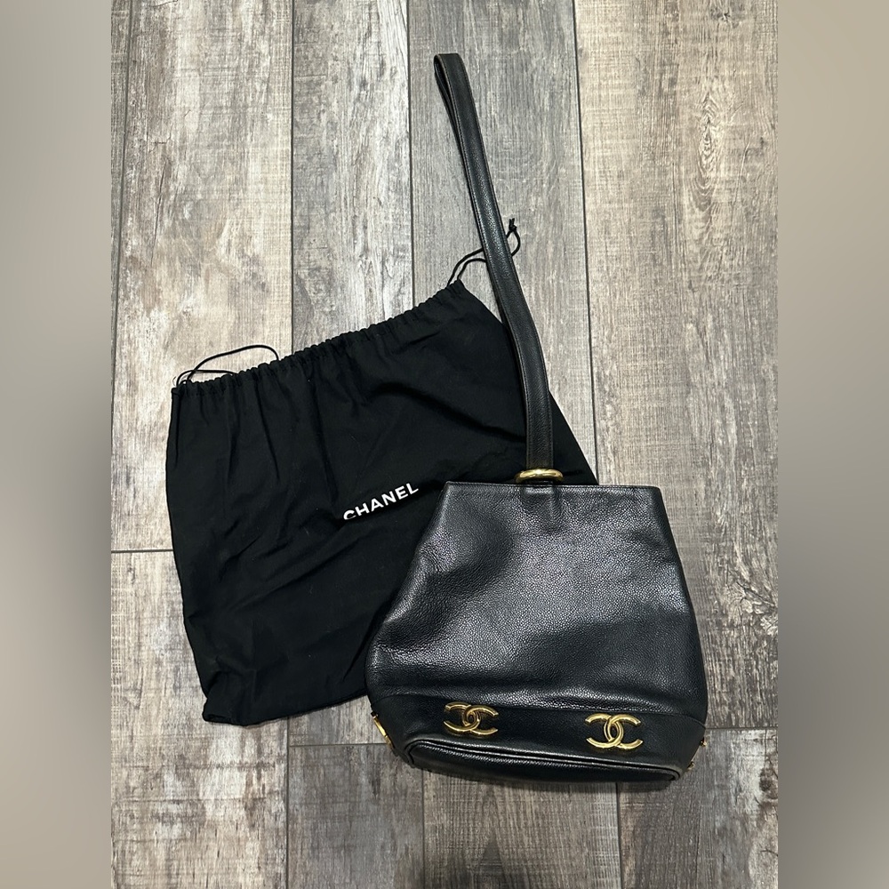 CHANEL Black Leather Bucket Bag with Gold Accents